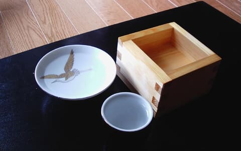Traditional Japanese sake cups with clear sake